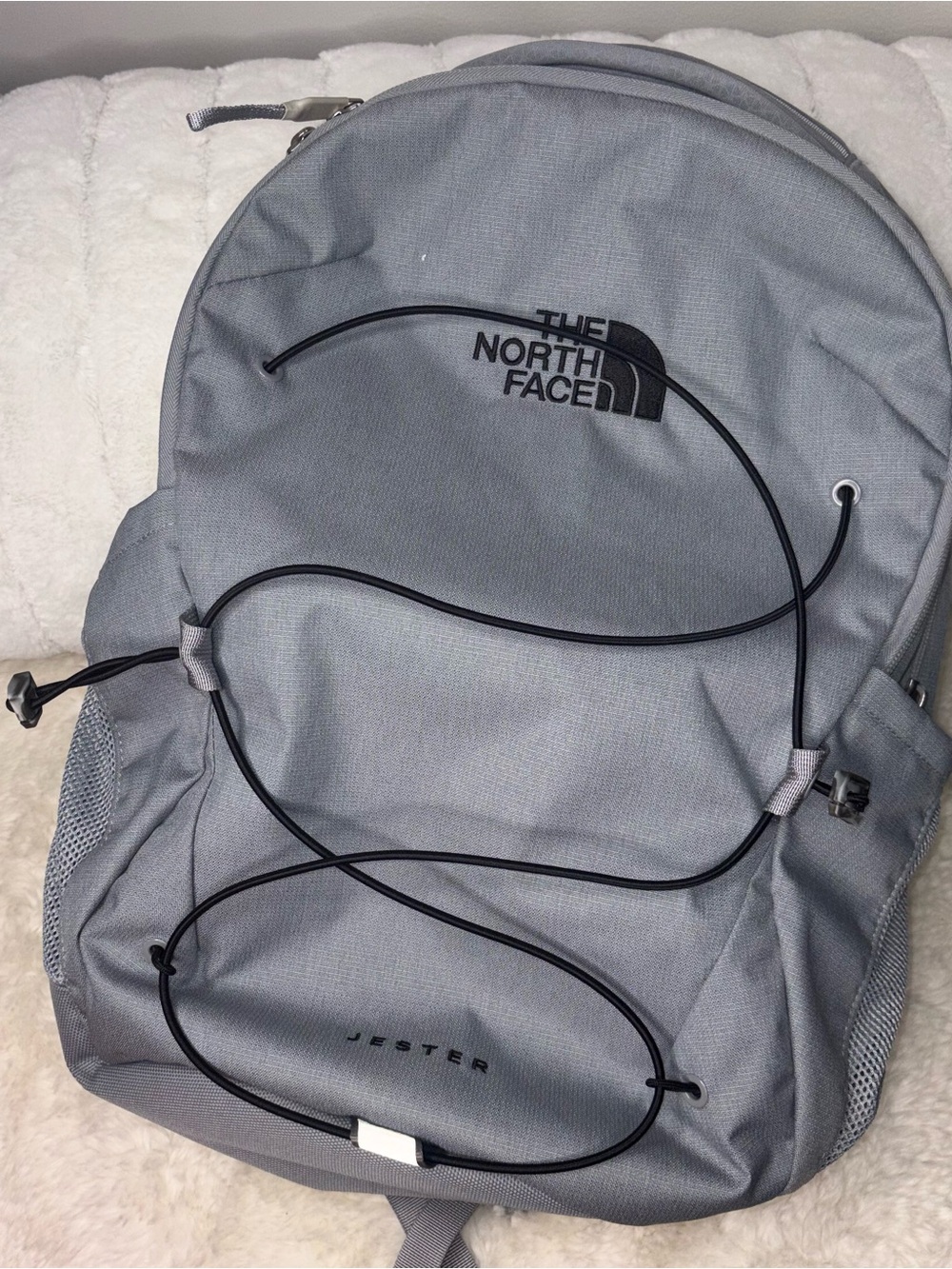 The North Face Jester Backpack in light gray with black bungee - Picture 1 of 4